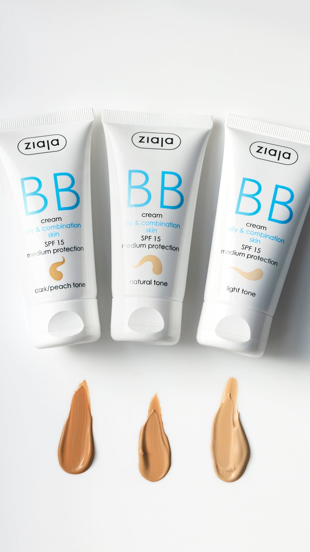 Three tubes of Ziaja BB cream with color samples on a white background