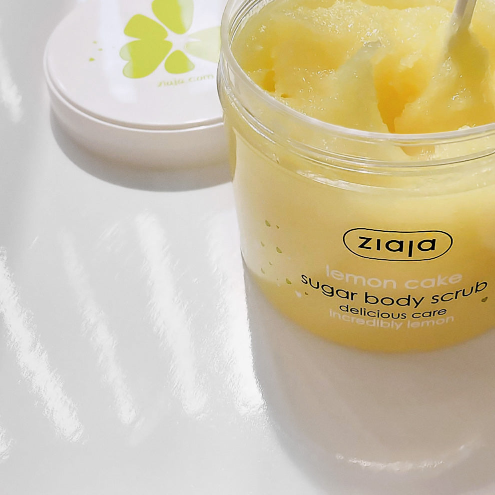 Jar of Ziaja Lemon Cake sugar body scrub with a spoonful of scrub visible.