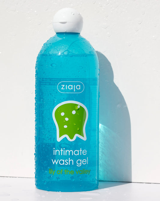 Blue bottle of Ziaja intimate wash gel on a white background