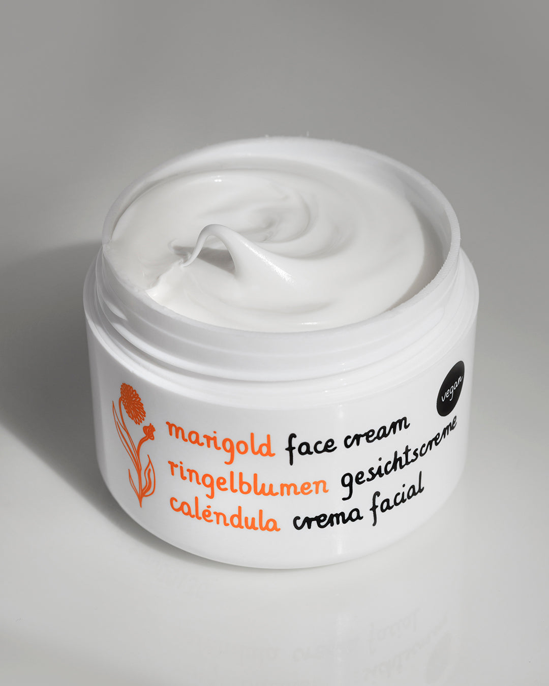 Jar of Ziaja Marigold Face Cream For Sensitive Skin 50Ml with 'marigold' branding on a gray background