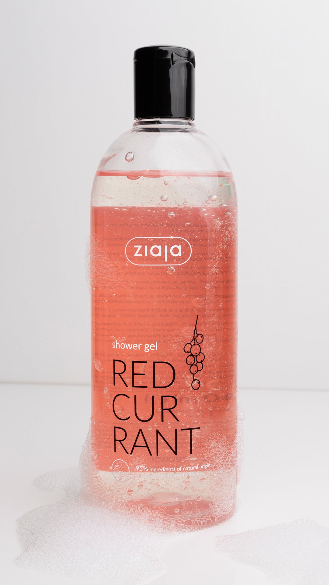 Bottle of Ziaja Red Currant shower gel on a white background