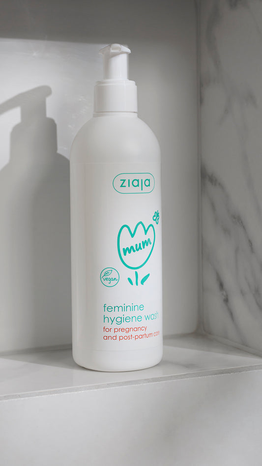 Ziaja Mum feminine hygiene wash bottle on a white shelf