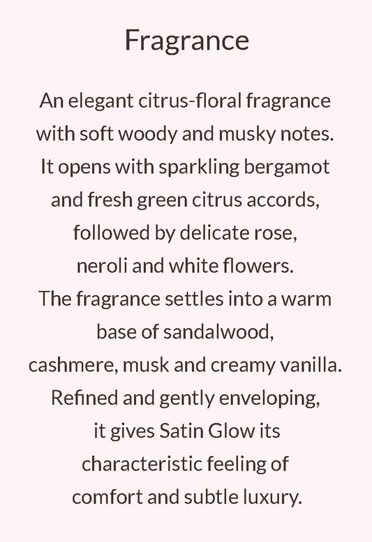 Text describing a fragrance with the heading 'Fragrance' on a pale pink background. The text details a citrus-floral scent with bergamot, green citrus, rose, neroli, white flowers, and a warm base of sandalwood, cashmere, musk, and creamy vanilla.