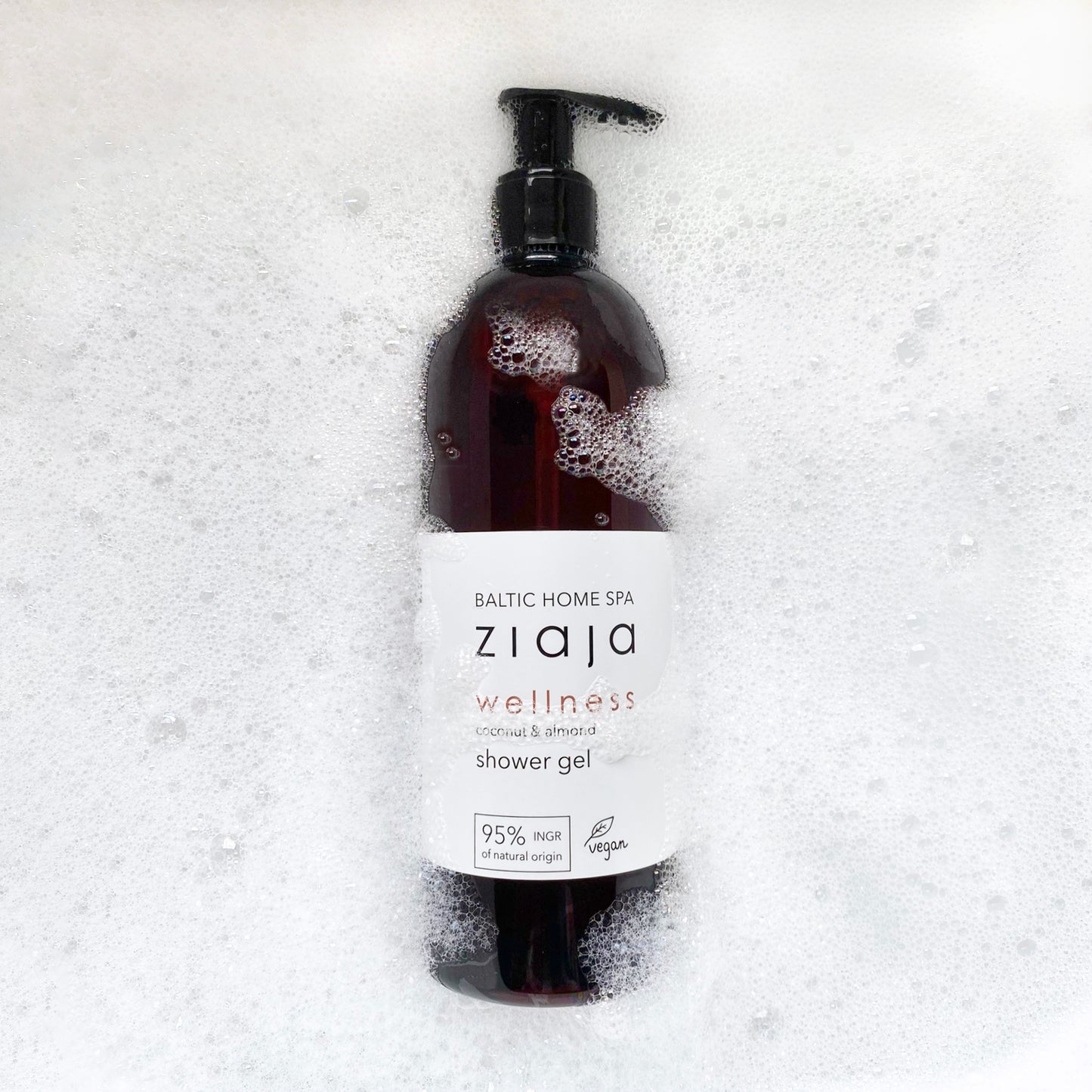 Ziaja shower gel bottle with pump on a white background