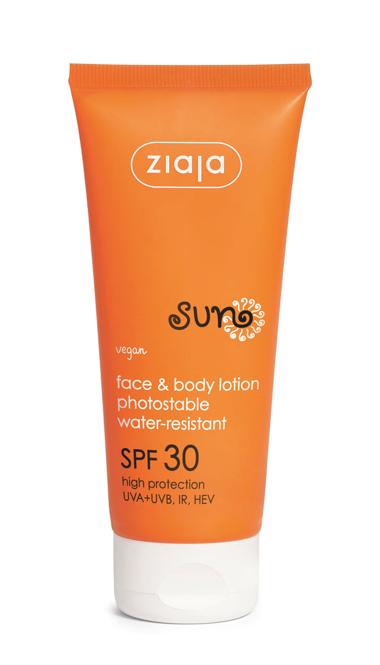 Orange tube of Ziaja Sun face and body lotion with SPF 30 on a white background