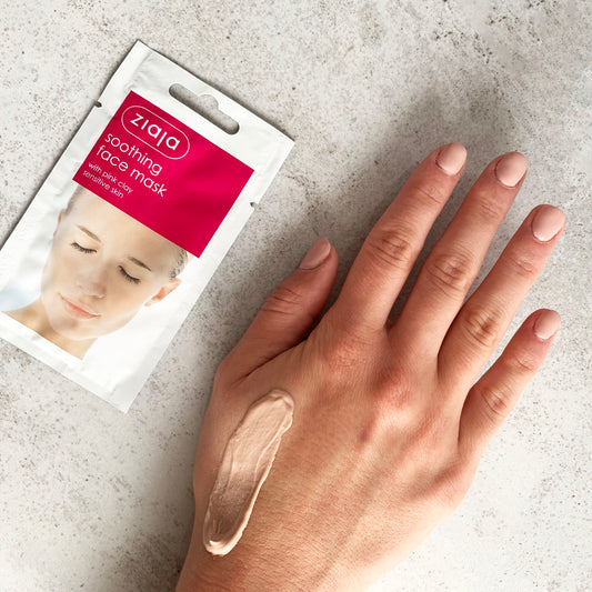Ziaja soothing face mask packaging with a hand applying the mask on a light gray background