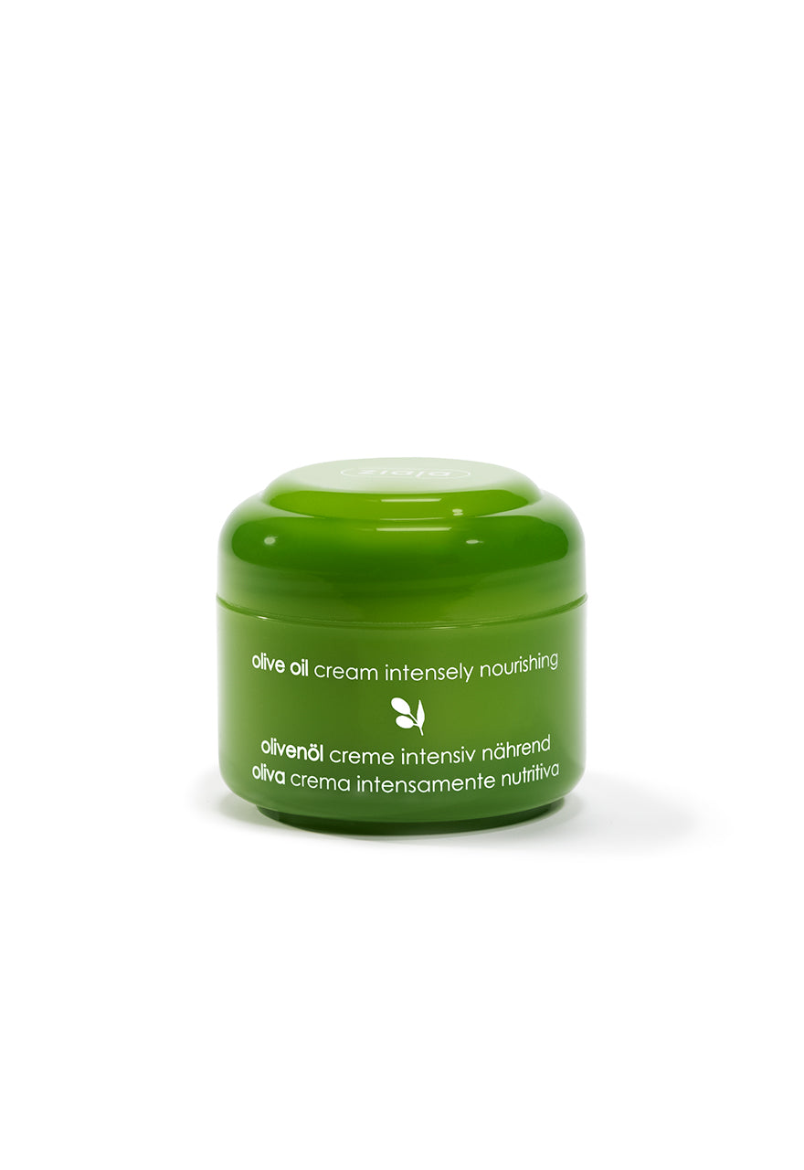 A green jar of Ziaja Olive Oil Cream, designed for face care.