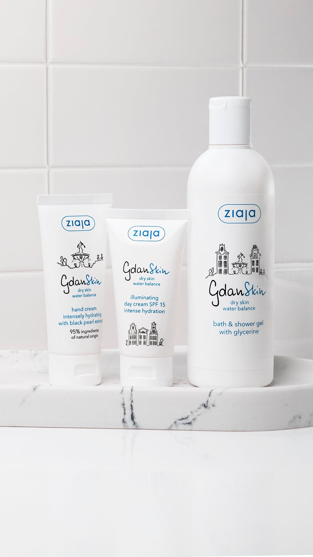 Ziaja skincare products on a marble surface with a tiled wall background