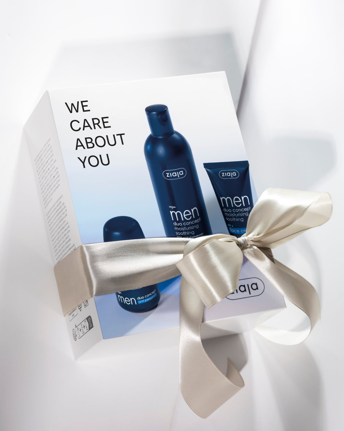 Ziaja Men Duo Concept gift set with face cream, roll-on antiperspirant and a skincare product, presented in a white gift box tied with a satin ribbon.
