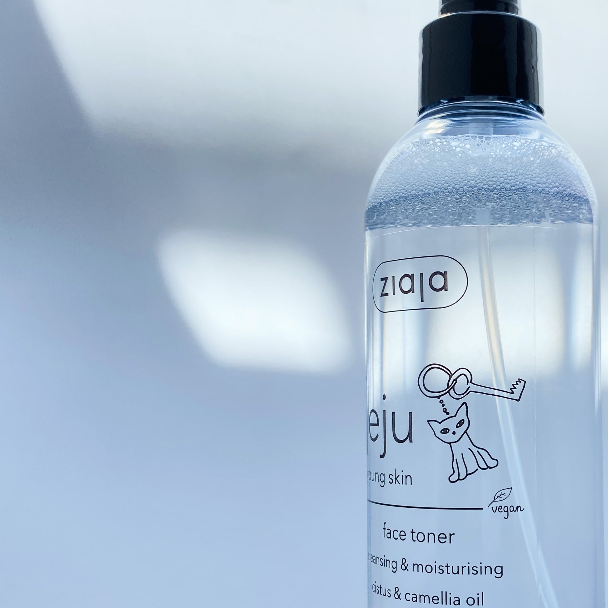 Ziaja face toner bottle with a blurred background
