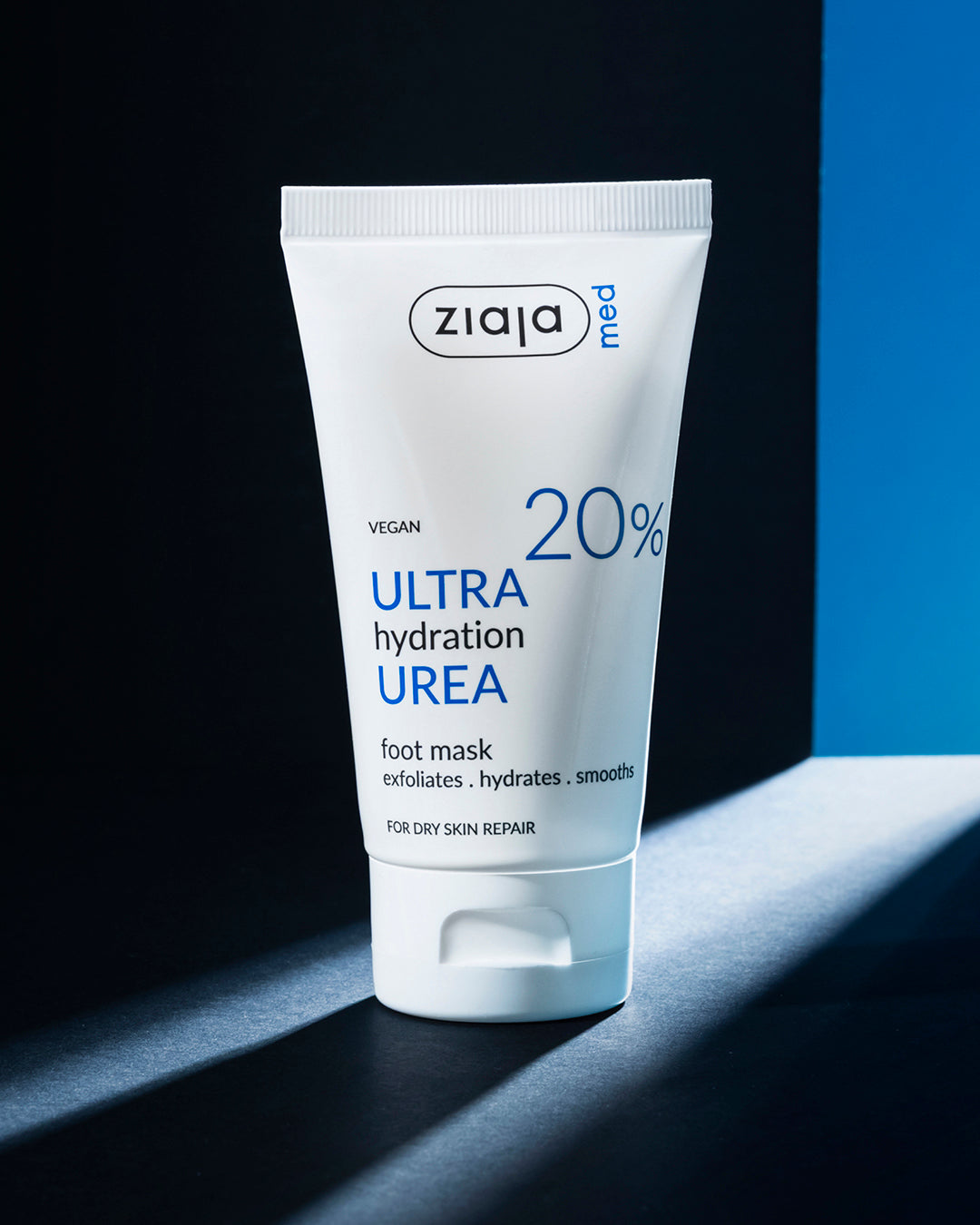Ziaja Med Urea Ultra Hydration Foot Mask 20% in White Tube on Dark Background
