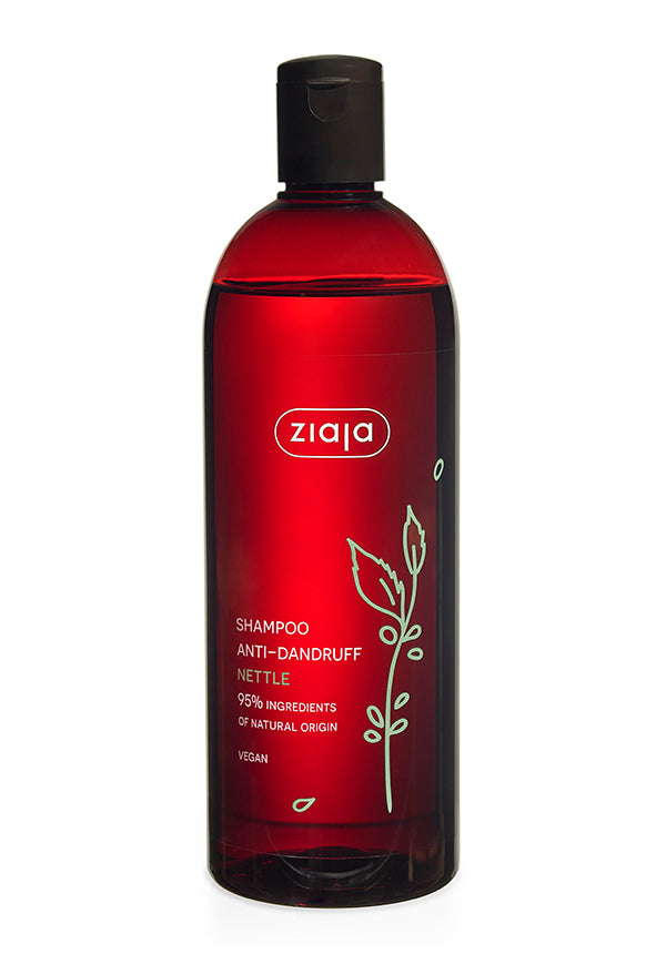 A red bottle of Ziaja Nettle Shampoo with a black cap. The label features an illustration of a nettle leaf.