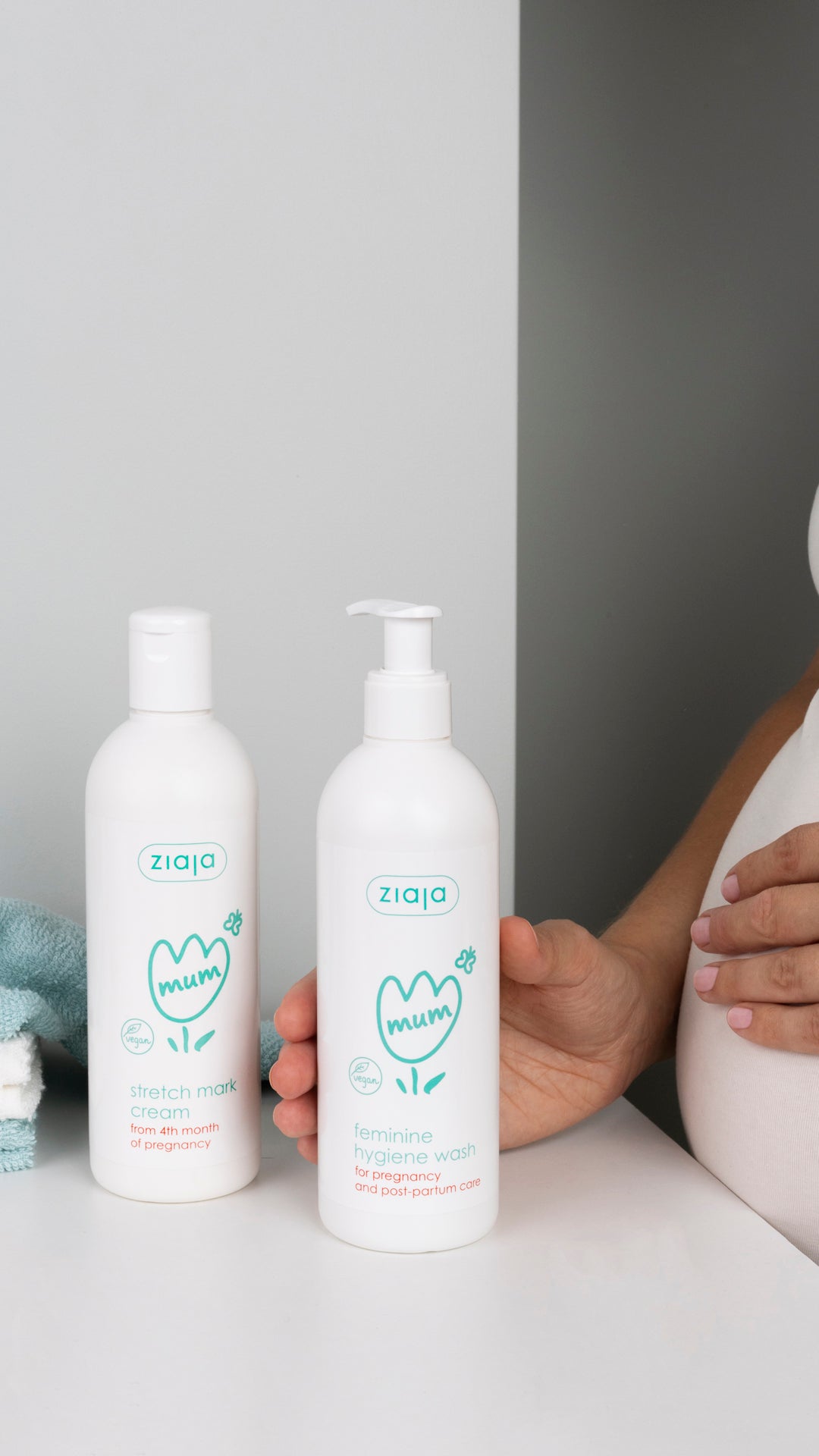 Two bottles of Ziaja skincare products on a white surface with a neutral background.