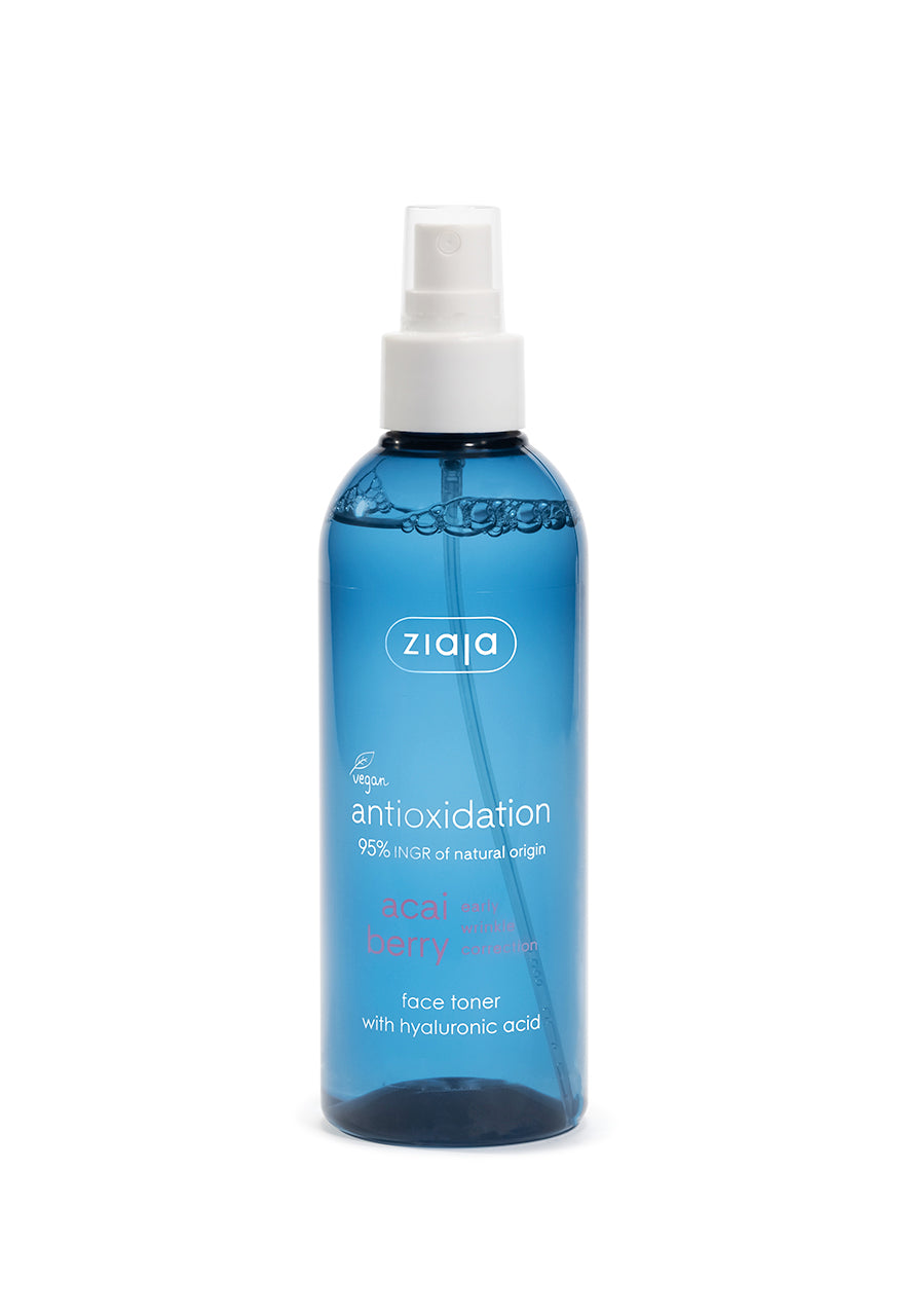 A blue spray bottle labeled Ziaja Acai Berry Face Toner with Hyaluronic Acid, designed for toning and moisturizing the skin.