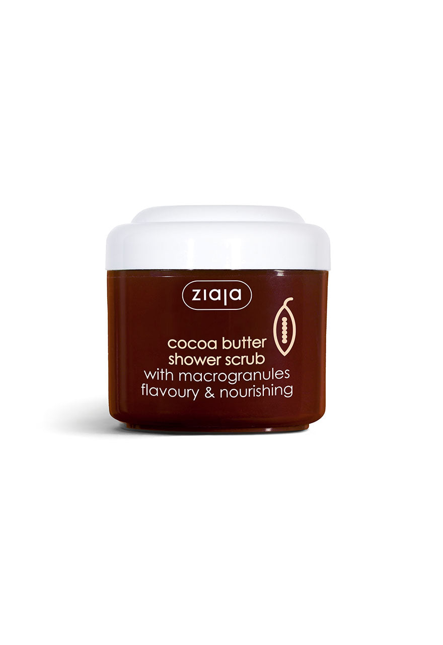A jar of Ziaja Cocoa Butter Shower Scrub with macrogranules. The container is brown with a white lid, and the label states that it is a nourishing and-flavoury body scrub.