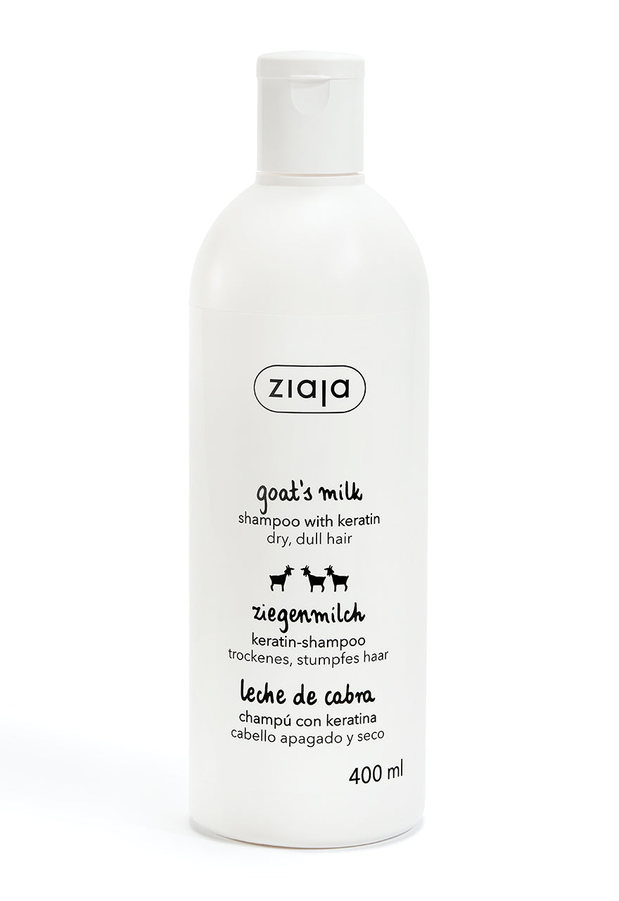 A bottle of Ziaja Goats Milk Shampoo with a white label and cap, on a white background.
