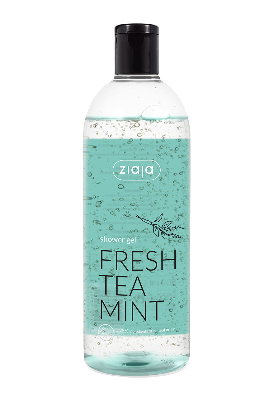 A clear plastic bottle of Ziaja Shower Gel with a label reading 'FRESH TEA MINT'. The gel appears clear and is dispensed through a black nozzle.